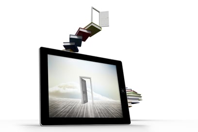 Open door on tablet screen against steps made out of books with open door