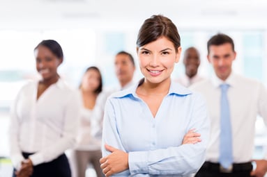 Successful woman leading a business group and smiling